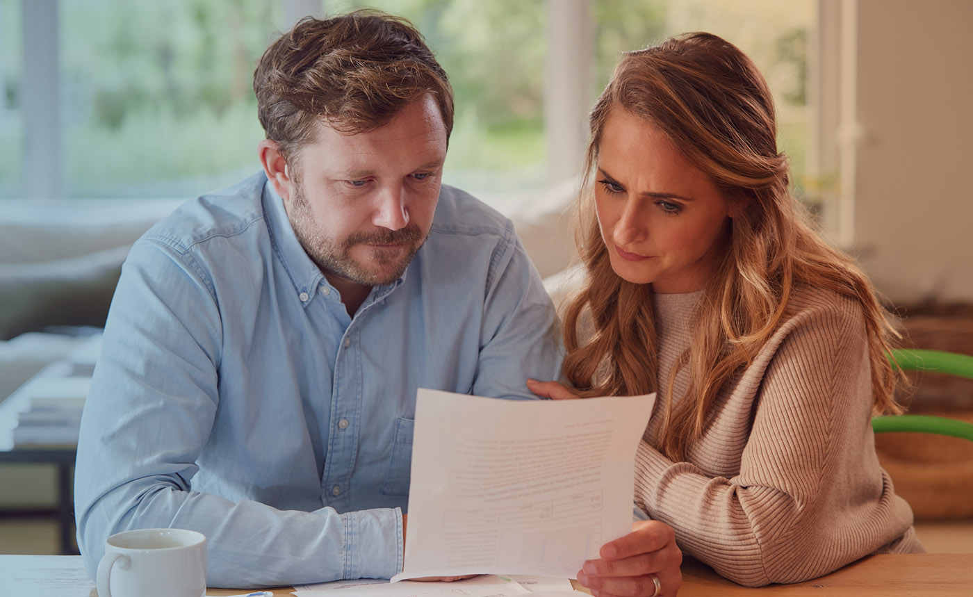 A couple reviewing donation request